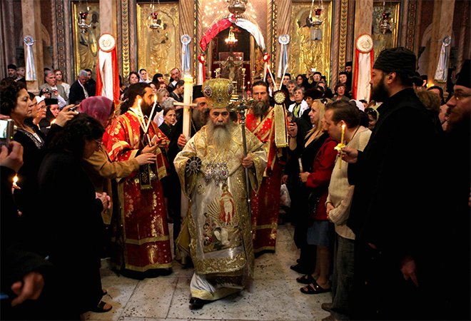 Greek Orthodox Patriarch of Jerusalem Theophilos III leads the Easter Sunday mass at the Church of the Holy Sepulchre