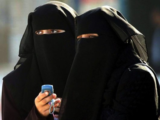 Two Islamic women in burqas
